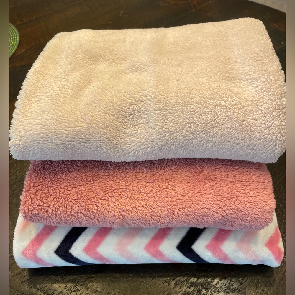 3 pink fleece baby blankets. 2 small solid receiving, one larger super soft.